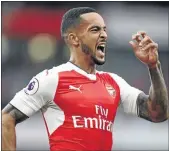  ?? PHOTO: PAUL GILHAM/GETTY IMAGES ?? Theo Walcott of Arsenal celebrates scoring his side’s second goal during the Premier League match against Chelsea at the Emirates Stadium on Saturday.