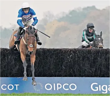  ??  ?? In control: Harry Cobden and Cyrname clear the last to win the Christy 1965 Chase from (right) Nico de Boinville, on Altior, at Ascot