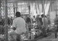  ?? U.S. CUSTOMS AND BORDER PROTECTION ?? People who’ve been taken into custody related to cases of illegal entry into the United States sit in one of the cages at a facility in McAllen, Texas.