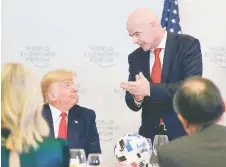  ?? — AFP photo ?? FIFA president Gianni Infantino (right) addresses US President Donald Trump during the Global Chief Executive Officers dinner at the World Economic Forum in Davos, Switzerlan­d.