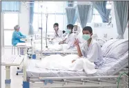  ?? AP/Thailand Government Spokesman Bureau ?? In this image made from video, three of the 12 boys who were rescued from a cave complex in Thailand are seen recovering in their hospital beds Wednesday after being rescued in Mae Sai, Chiang Rai province, northern Thailand.