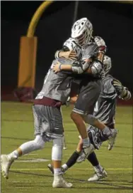  ?? PETE BANNAN — DIGITAL FIRST MEDIA ?? Conestoga’s Nicholas Cost ( 4), embraces Nick Braendel ( 6) following Braendel’s overtime goal to defeat Avon Grove Tuesday night.