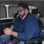  ??  ?? Once inside and secured in his van, James Myers can get work done while on the road February 6, 2019.