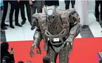  ??  ?? UAE-made robot Titan entertains visitors on the second day of the Internatio­nal Defence Exhibtion and Confrence.