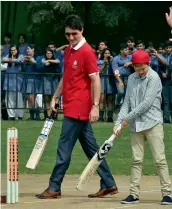  ?? — PTI ?? Canadian Prime Minister Justin Trudeau with his son Xavier during their visit to a school in New Delhi on Thursday. Mr Trudeau also visited Jama Masjid and Sacred Heart Church with his wife and three children in the morning.