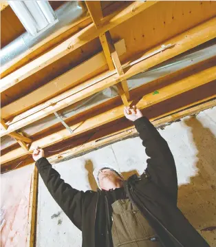  ?? ALEX SCHULDTZ/THE HOLMES GROUP. ?? You can finish your crawl space as a livable space, but Mike Holmes recommends extending your home into the yard if possible, rather than going underneath.