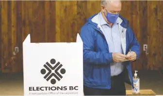  ?? CHAD HIPOLITO/ THE CANADIAN PRESS ?? NDP Leader John Horgan is one of more than 383,477 people to cast a ballot during the first four days of advanced voting from Oct. 15-18. Advanced voting continues until Wednesday.