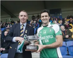  ??  ?? County chairman Martin Fitzgerald presents the cup to Paul Gahan.