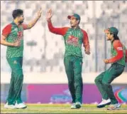  ?? AP ?? Bangladesh captain Mashrafe Mortaza (left) celebrates with teammates the dismissal of Hamilton Masakadza on Tuesday.