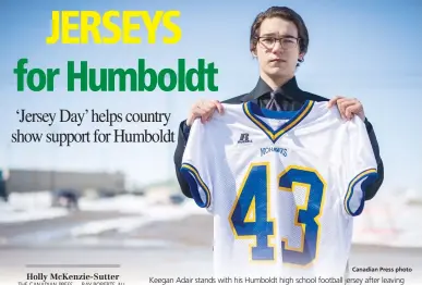  ?? Canadian Press photo ?? Keegan Adair stands with his Humboldt high school football jersey after leaving Elgar Petersen Arena following a memorial service for Humboldt Broncos play-byplay announcer Tyler Bieber in Humboldt, Sask. on Thursday. Adair was an honorary pallbearer...