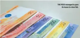  ??  ?? THE PESO managed to pare its losses to close flat.