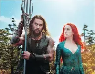  ?? WARNER BROS. PICTURES VIA AP ?? Jason Momoa, left, and Amber Heard star in Aquaman, which is on track to reel in $1.1 billion in ticket sales.