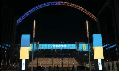  ?? ?? The Wembley arch, lit with the colours of Ukraine’s flag in February 2022. Photograph: Scott Garfitt/Shuttersto­ck