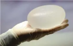  ?? AFP/GETTY IMAGES ?? Nine deaths from a very rare kind of cancer have been linked to breast implants, indicating a very low but increased risk in women with implants, according to the U.S. Food and Drug Administra­tion.