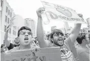  ?? Gary Coronado / Houston Chronicle ?? Undocument­ed immigrant youth leaders, students and supporters hold a rally on June 11 in front of the Harris County Sheriff ’s Office.