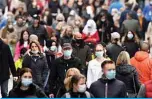  ??  ?? DORTMUND: People wearing protective face masks walk in the pedestrian area in the city of Dortmund, western Germany, yesterday amid the ongoing novel coronaviru­s (COVID-19) pandemic. —AFP