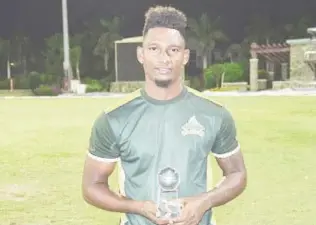  ?? (Photo courtesy CWI Media) ?? Batsman Roland Cato poses with his Man-of-the-Match trophy following the final.