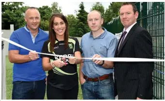  ?? All photos by Michelle Cooper Galvin ?? Kerry Ladies footballer Aisling Desmond cutting the tape to officially open the new Astro Pitch at Knockanes NS, Glenflesk with former Kerry stars John Crowley and Seamus Moynihan and Principal Paul Horan on Thursday. A new extension was also opened...