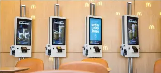  ?? MCDONALD’S ?? Customers to the new McDonald’s can order via new touch- screen kiosks.