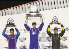  ?? Scott Kane / Associated Press ?? Josef Newgarden (center) celebrates a win last month next to runner-up Scott Dixon (left) and third-place Simon Pagenaud.