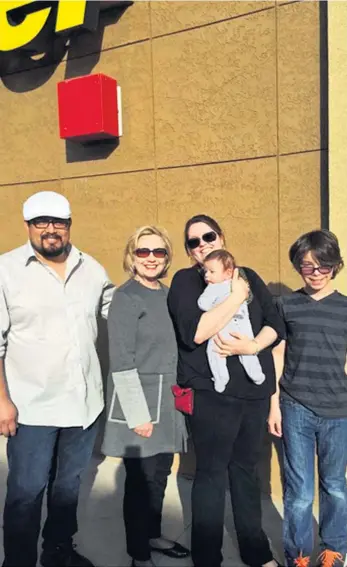  ??  ?? Hillary Clinton tweeted this picture of a family she met during the first part of her road trip yesterday