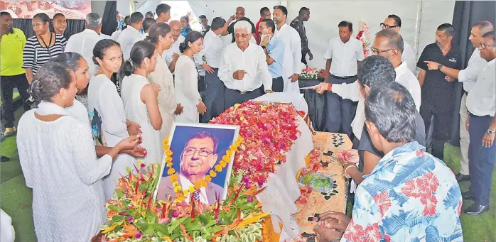  ?? Picture: REINAL CHAND ?? Family members pay their last respects during the funeral service of Vinod Patel in Ba early this month.