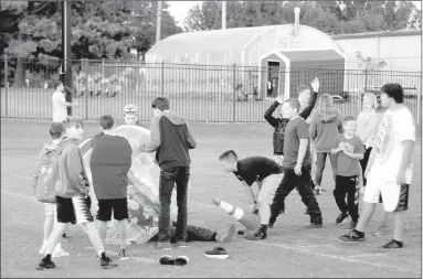  ?? MARK HUMPHREY ENTERPRISE-LEADER ?? Youth enjoyed an opportunit­y to play on Farmington’s football field during the Fellowship of Christian Athletes event called Fields of Faith held at Farmington’s Allen Holland Field on Wednesday, Oct. 10, 2018.