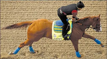  ?? AP/CHARLIE RIEDEL ?? Justify, which was the 7-2 favorite in early wagering Friday, is undefeated going into today’s Kentucky Derby at Churchill Downs in Louisville, Ky.