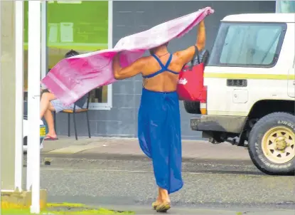  ?? Picture: FILE/ATU RASEA ?? A sex worker crosses Central Street in Suva.