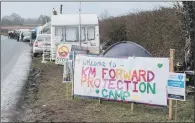  ??  ?? SIGN OF THE TIMES: Anti-fracking posters along the roadside near the entrance of the fracking site on the edge of Kirby Misperton.