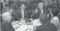  ?? NICHOLAS KAMM, AFP/GETTY IMAGES ?? President Trump, Japanese Prime Minister Shinzo Abe, his wife, Akie, first lady Melania Trump and Robert Kraft, owner of the New England Patriots football team, sit down for dinner at Trump’s Mar-a-Lago resort in Florida on Feb. 10.