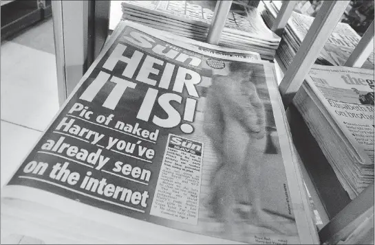  ?? — REUTERS ?? The Sun has become the first British newspaper to run those now-famous photos of a naked Prince Harry.