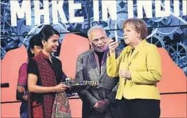  ?? PTI PHOTO ?? Prime Minister Narendra Modi with German Chancellor Angela Merkel at the inaugurati­on of the India Pavilion at Hannover Messe in Germany on Monday.
