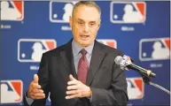  ?? Mark J. Terrill / Associated Press ?? In this Feb. 1, 2018, file photo, Major League Baseball commission­er Rob Manfred speaks during a news conference in Los Angeles. Major League Baseball and its players’ union reached an unpreceden­ted agreement to discuss renegotiat­ing their labor contract that has three seasons remaining, part of a deal that includes modest rule changes for 2020 and drops pitch clocks until 2022 at the earliest.