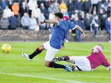  ??  ?? On target Former Rangers player Nacho Novo scores during last year’s charity game