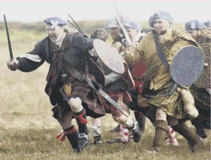  ??  ?? 0 A re-enactment of a Highland charge for a short film about the battle of Culloden