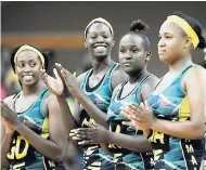  ?? PHOTOS BY RICARDO MAKYN/MULTIMEDIA PHOTO EDITOR ?? Members of the Sunshine Girls applauding before the Jamaica versus Barbados Netball ‘Test’ at the National Arena on Friday. From left: Stacian Facey, Shimona Nelson, Hasana Williams and Thristina Hardwood.