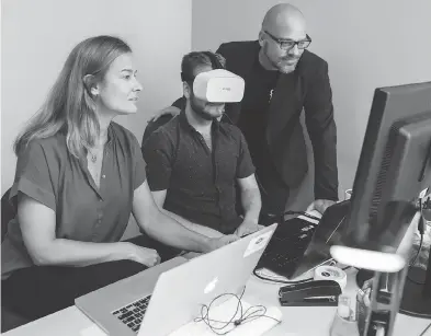  ?? DARIO AYALA FOR NATIONAL POST ?? Isabel Galiana, co-founder and chief executive of Saccade Analytics, Sam Collins, centre, and Richard Chénier, director-general of Centech, at the Centech incubator offices in Montreal.