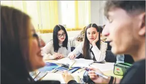  ?? ?? High school pupils react during a lesson on the Holocaust in a school in Focsani, eastern Romania.