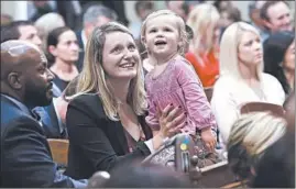  ?? RICH PEDRONCELL­I/AP ?? “Sometimes to fight for change you need a little help changing the diaper,” said California Assemblywo­man Buffy Wicks, whose daughter was 6 months old when she ran.