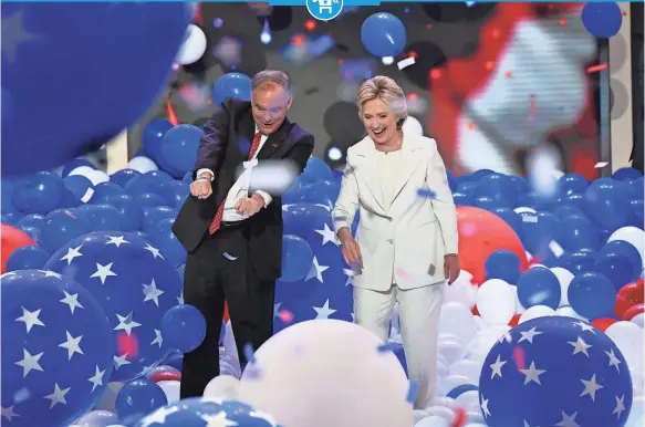  ?? ROBERT DEUTSCH, USA TODAY ?? Hillary Clinton and running mate Tim Kaine are awash in balloons as the crowd roars Thursday at Wells Fargo Center after Clinton’s acceptance speech.