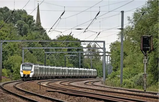  ?? COLIN POTTLE. ?? Govia Thameslink Railway 700105 passes Offord Cluny (south of Huntingdon) on July 7, with the 1324 Peterborou­gh-Horsham. Wolmar believes the messaging regarding travel has done irreparabl­e damage to the industry.