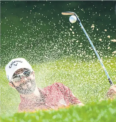  ?? NATHAN DENETTE/THE CANADIAN PRESS ?? Canadian Adam Hadwin had a blast on the ninth hole in Friday’s second round at Glen Abbey. He managed to get up and down for par, but back-to-back bogeys on the back nine proved costly. At 3 under, he missed the cut by a stroke.