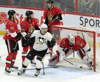  ?? JUSTIN TANG/THE CANADIAN PRESS ?? Patric Hornqvist and the Penguins stormed to a 3-0 lead Tuesday but Ottawa came back to win in overtime.