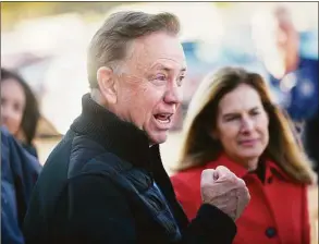  ?? Tyler Sizemore / Hearst Connecticu­t Media ?? Gov. Ned Lamont campaigns with fellow Democrats outside the District 7 polling center at Greenwich High School in Greenwich on Election Day Tuesday. After a comfortabl­e victory, Lamont said he had no plans to shakeup his policy agenda.