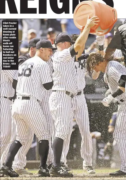  ??  ?? Clint Frazier takes in a well-earned dousing at home plate after rookie blasts walk-off home run Saturday to bail out Bombers on red-letter day in the Bronx . USA TODAY