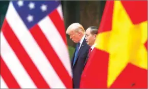  ?? KHAM/AFP ?? US President Donald Trump and Vietnam’s President Tran Dai Quang attend a press conference at the Presidenti­al Palace in Hanoi yesterday.