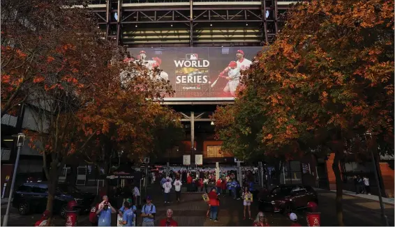  ?? CHRIS SZAGOLA — THE ASSOCIATED PRESS ?? Fans arrive at Citizens Bank Park for Game 4of the World Series between the Houston Astros and the Philadelph­ia Phillies on Wednesday.
