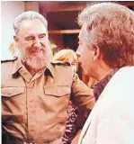  ?? COURTESY OF MARK SLIMP ?? TV news producer Mark Slimp is introduced to Fidel Castro during Slimp’s visit to Cuba.