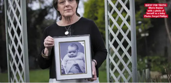  ?? Photo: Fergal Phillips ?? MARIA BOYLAN’S STORY QUEST FOR TRUTH: Maria Boylan with a photo of herself as a baby